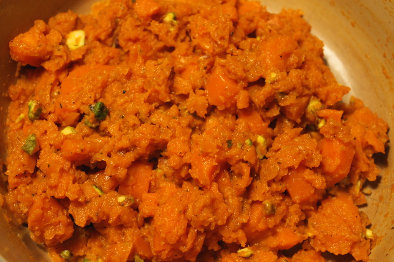 crushed carrots with harissa and pistachios
